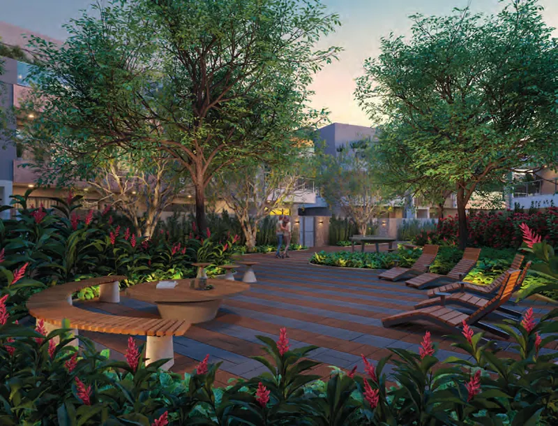 Praça arborizada com deck e lounge no Claris Casa & Clube